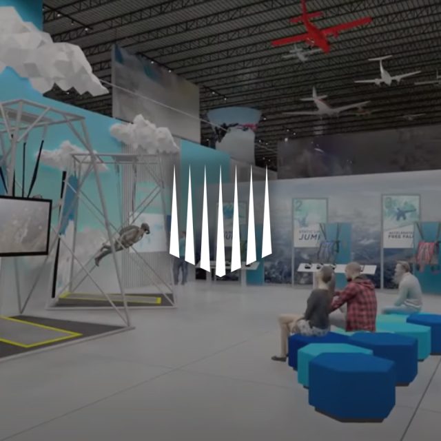 A futuristic exhibit with interactive displays, featuring a person in a harness appearing to fly. Families are seated on blue stools. The space has high ceilings and is decorated with clouds and aircraft models.