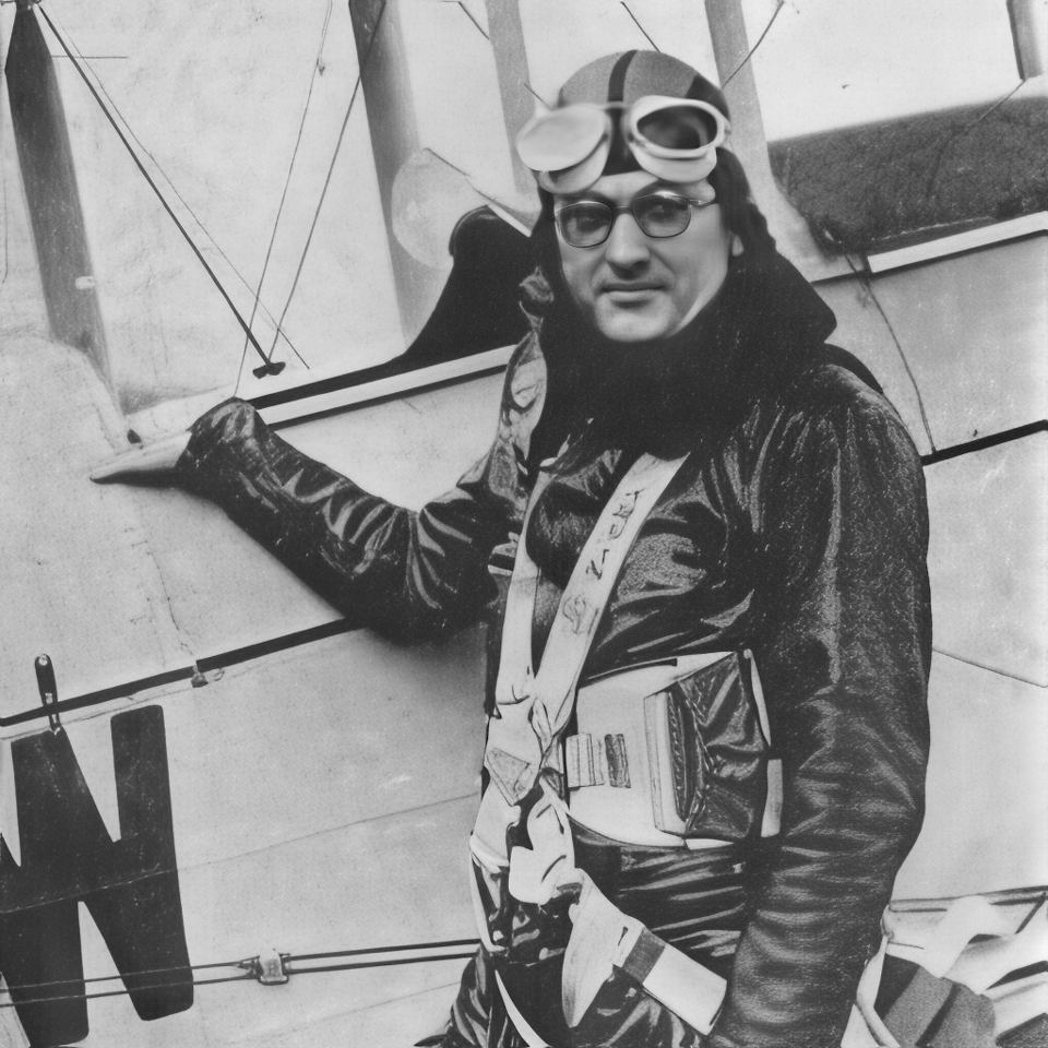 A person wearing vintage aviation gear, including goggles and a leather helmet, stands next to an old biplane. The individual is wearing a leather flight suit and harness, with one hand resting on the aircraft's wing. The image is in black and white.