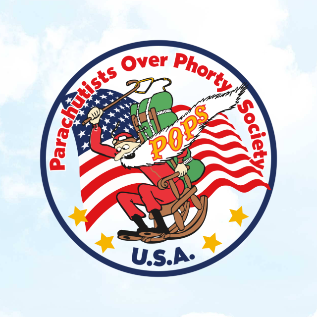 Logo of the Parachutists Over Phorty Society (POPS), featuring a cartoon character in red, wearing a parachute, seated on a rocking chair. The background is an American flag. Text reads "Parachutists Over Phorty Society U.S.A.